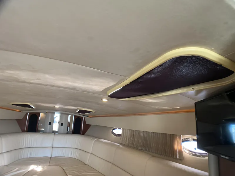 Slide: The Image of Interior cabin of a 2006 Formula 400 Super Sport boat with white leather seating. - 25