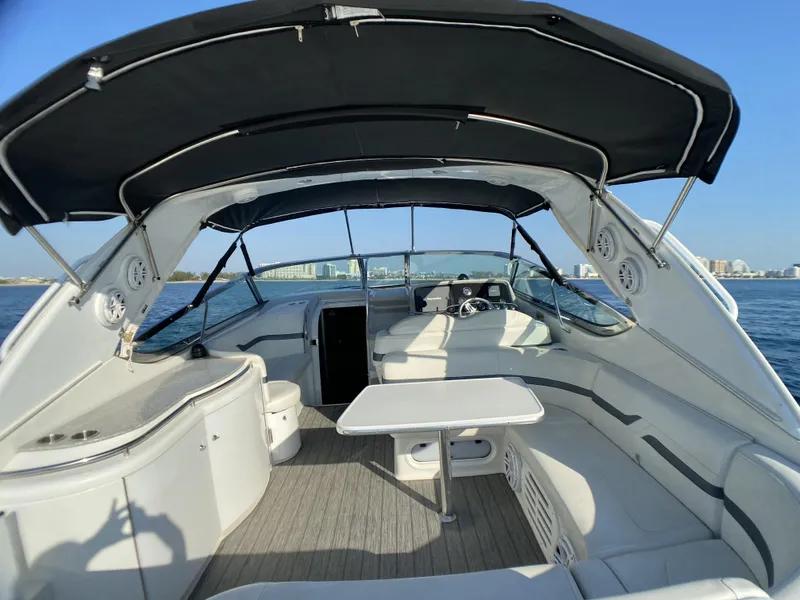 Slide: The Image of 2006 Formula 400 Super Sport yacht interior with seating and table on open water. - 33