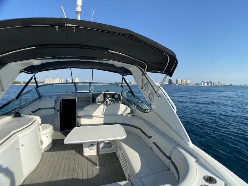 Slide: The Image of 2006 Formula 400 Super Sport boat interior with ocean and city skyline in the background. - 34
