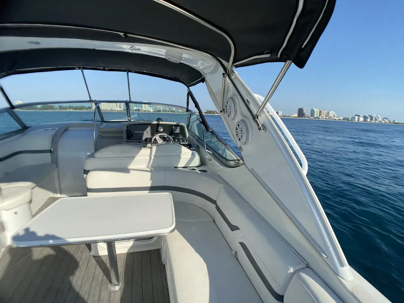 Slide: The Image of 2006 Formula 400 Super Sport boat interior with ocean and city skyline in the background. - 38