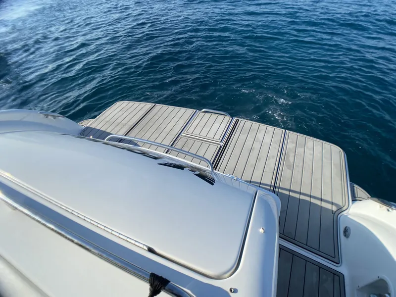 Slide: The Image of 2006 Formula 400 Super Sport boat deck on calm blue water. - 43