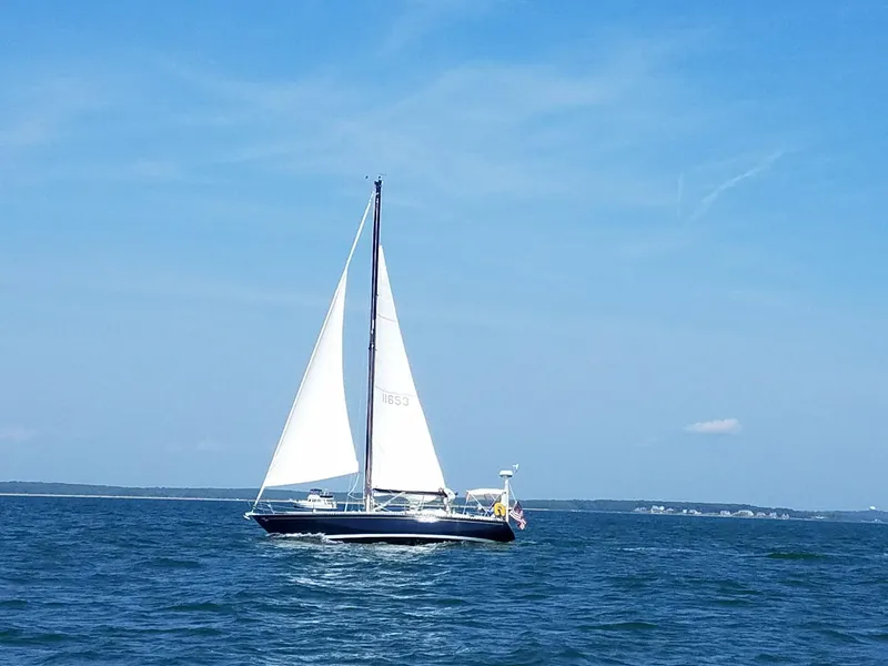 The Image of Sailboat Tartan 41 from 1972 on open sea under clear blue sky. - 0
