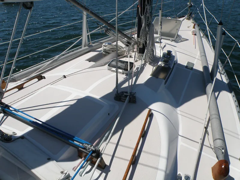 Slide: The Image of Sailboat deck of 1972 Tartan 41, featuring rigging and ocean backdrop. - 7