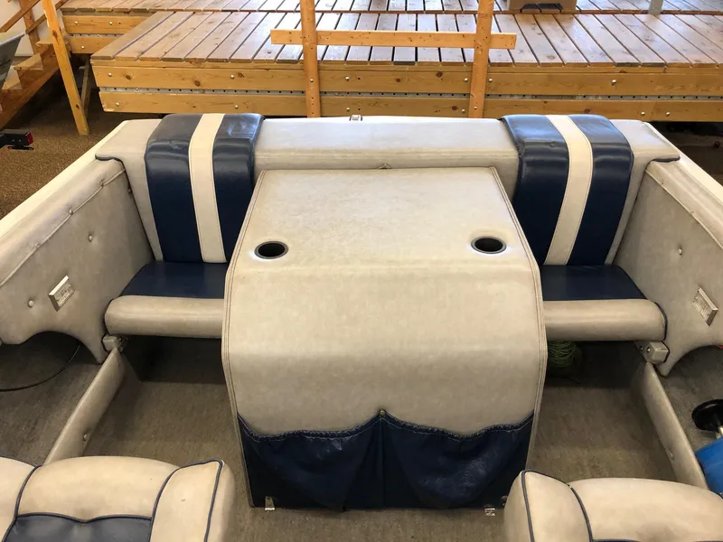 Slide: The Image of 1984 Sea Sprite 18' Cuddy Cabin boat interior with blue and white seating. - 14