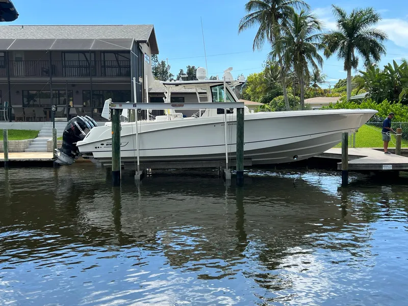 The Image of 2013 Boston Whaler 370 Outrage docked near waterfront home. - 0