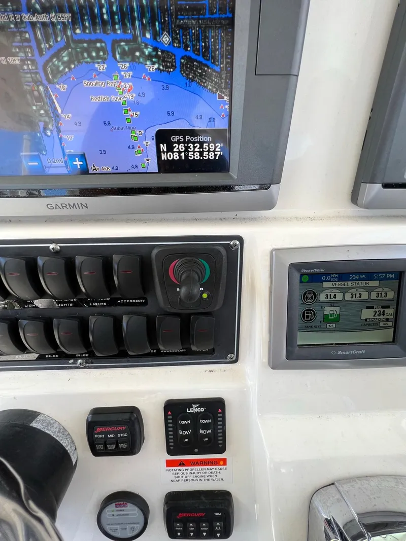 Slide: The Image of Control panel of a 2013 Boston Whaler 370 Outrage with GPS and navigation systems. - 18