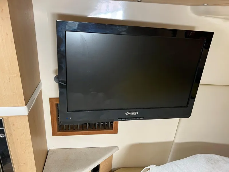 Slide: The Image of Flat-screen TV in the cabin of a 2013 Boston Whaler 370 Outrage boat. - 27