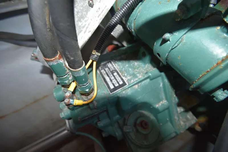 Slide: The Image of Close-up of the engine compartment in a 2001 Camano 31 Trawler boat. - 13