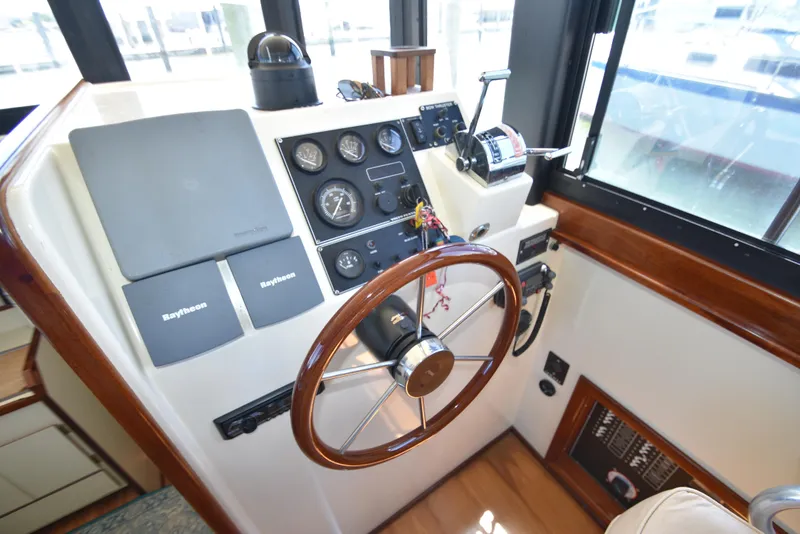 Slide: The Image of Helm station of a 2001 Camano 31 Trawler with Raytheon navigation equipment. - 17