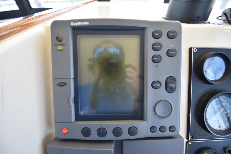Slide: The Image of Raytheon Pathfinder R70 radar display on 2001 Camano 31 Trawler. - 18