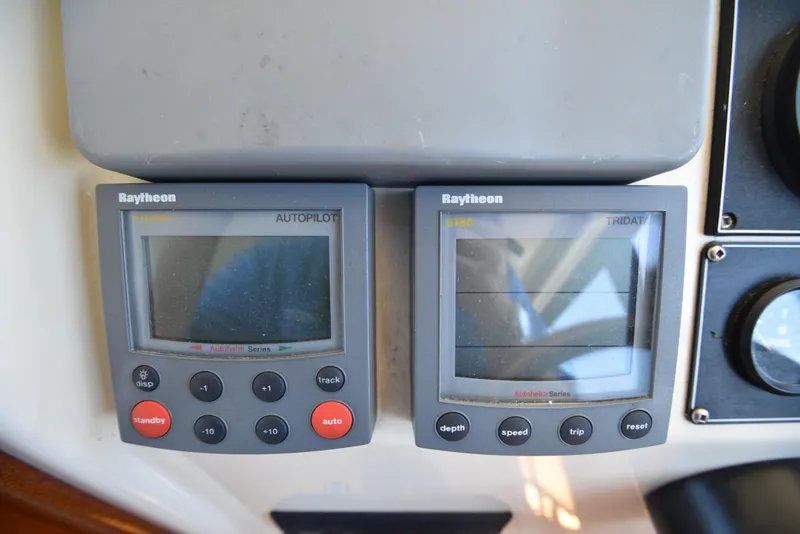 Slide: The Image of Raytheon autopilot and tridata displays on 2001 Camano 31 Trawler boat. - 20