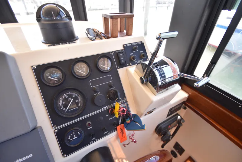 Slide: The Image of Helm station of a 2001 Camano 31 Trawler with navigation instruments and controls. - 21