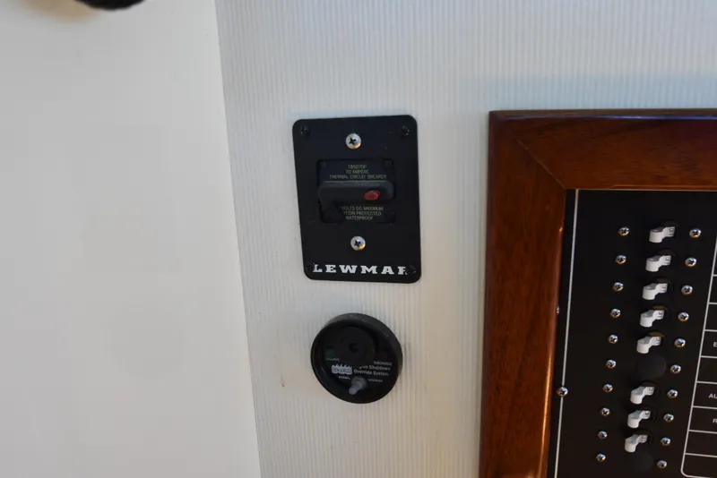 Slide: The Image of Lewmar circuit breaker and control panel on a 2001 Camano 31 Trawler. - 28