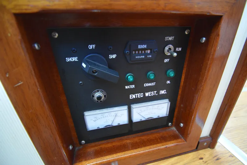 Slide: The Image of Control panel of a 2001 Camano 31 Trawler with Entec West, Inc. gauges. - 35