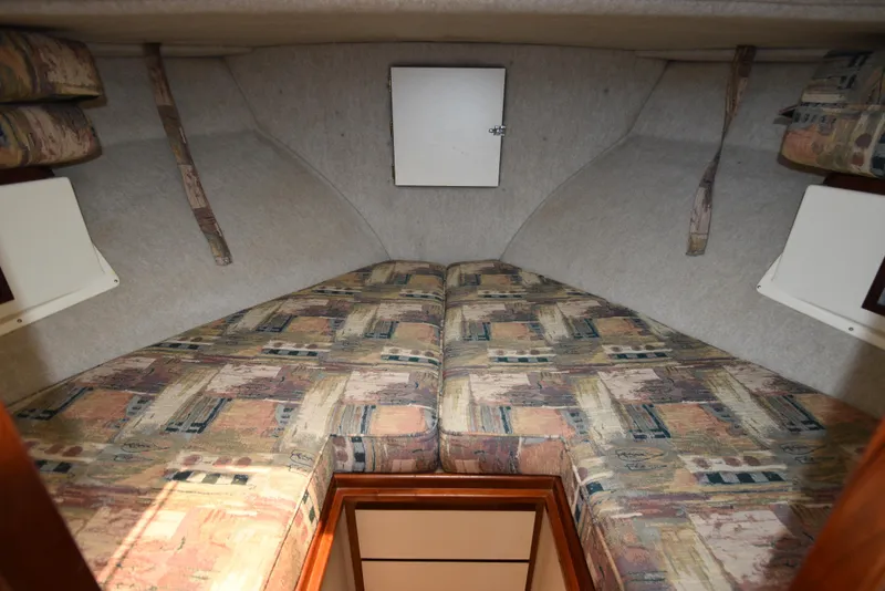 Slide: The Image of Interior cabin of 2001 Camano 31 Trawler with patterned cushions. - 6