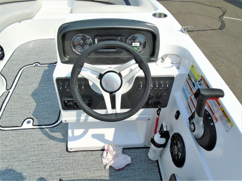 Slide: The Image of 2022 Hurricane SS188 boat dashboard with steering wheel and control panel. - 6