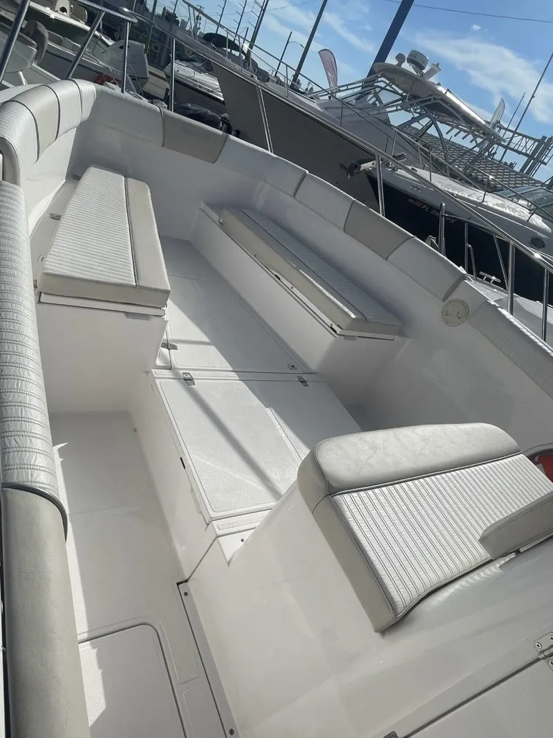 Slide: The Image of 2022 Wellcraft 275cc boat interior with seating and storage compartments. - 6