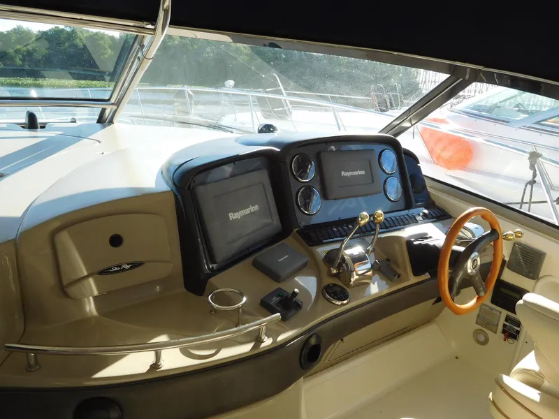 Slide: The Image of Helm of 2005 Sea Ray 420 Sundancer with Raymarine navigation systems. - 18