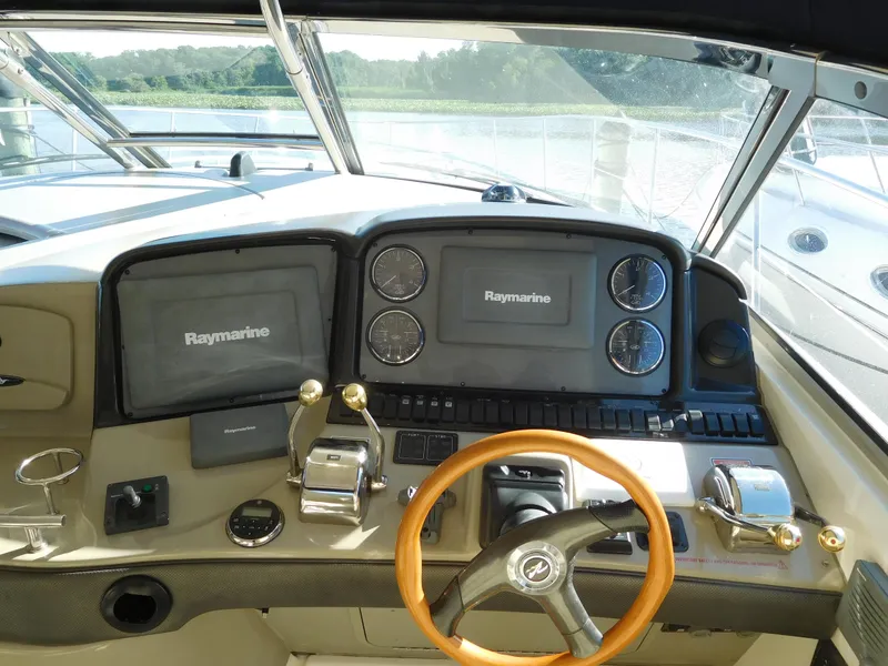 Slide: The Image of Helm of 2005 Sea Ray 420 Sundancer with Raymarine electronics. - 19