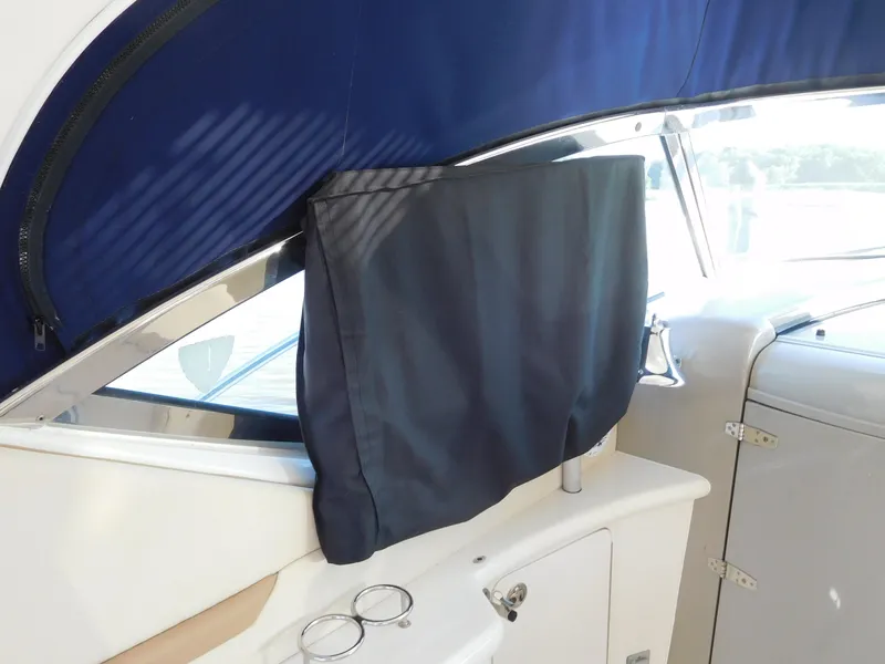 Slide: The Image of Interior view of 2005 Sea Ray 420 Sundancer with covered window and blue canopy. - 27