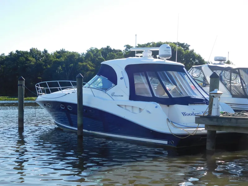 Slide: The Image of 2005 Sea Ray 420 Sundancer docked in a marina. - 3