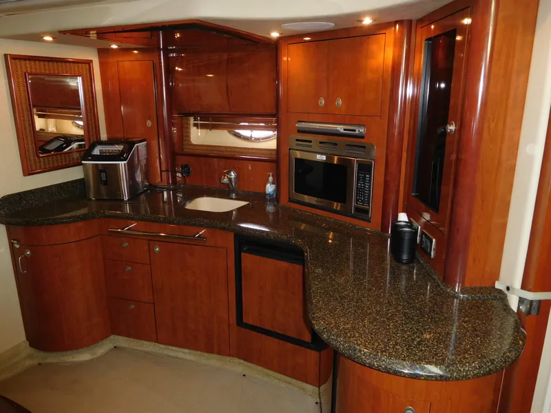 Slide: The Image of Luxurious kitchen area in a 2005 Sea Ray 420 Sundancer yacht with modern appliances. - 31