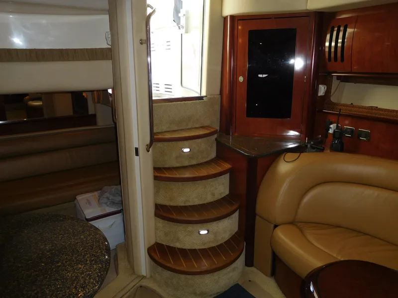 Slide: The Image of Interior of 2005 Sea Ray 420 Sundancer yacht with wooden steps and leather seating. - 34