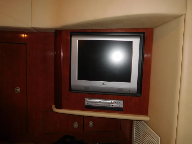 Slide: The Image of Built-in TV and DVD player in the cabin of a 2005 Sea Ray 420 Sundancer yacht. - 37
