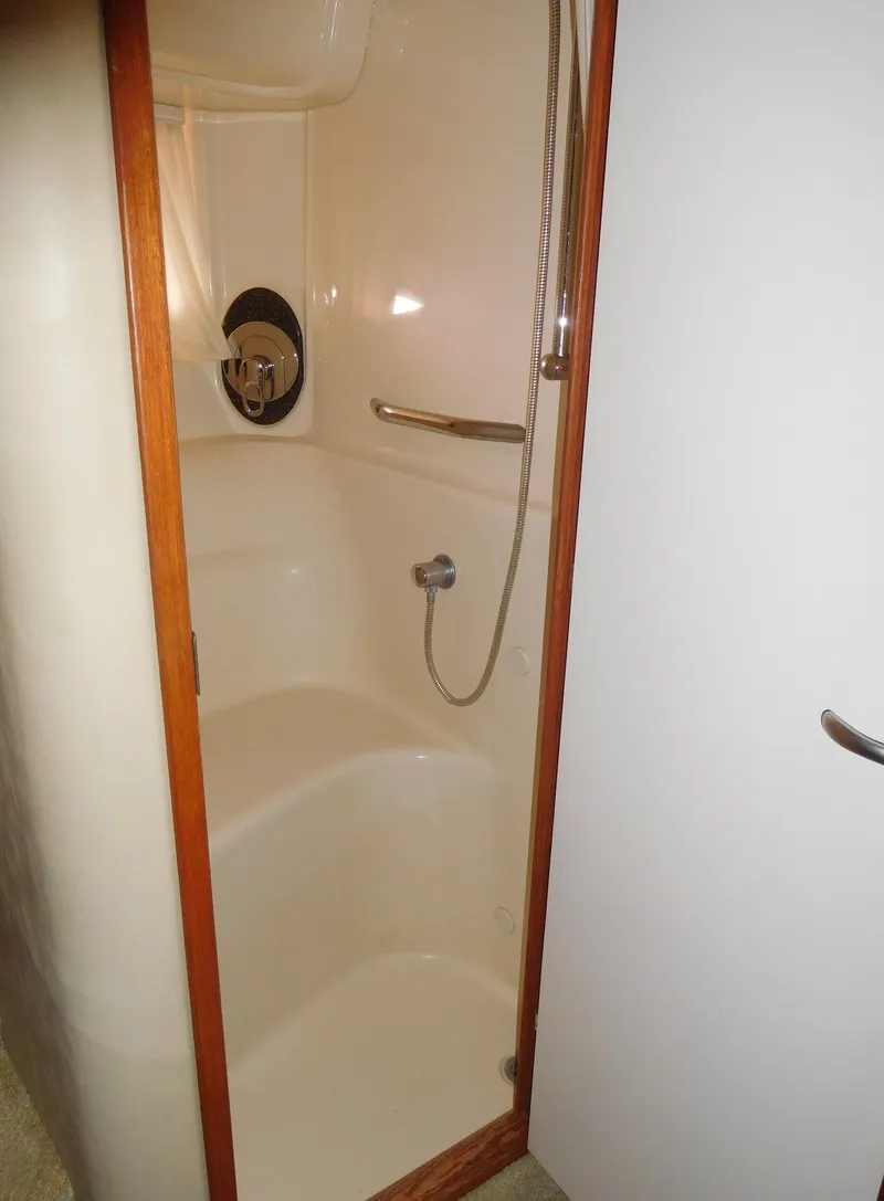 Slide: The Image of 2005 Sea Ray 420 Sundancer shower with built-in seat and handheld showerhead. - 46