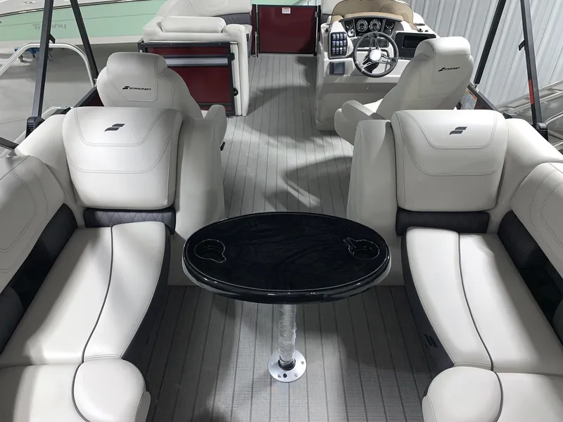 Slide: The Image of 2024 Starcraft SLS 3 boat interior with white leather seating and black table. - 3