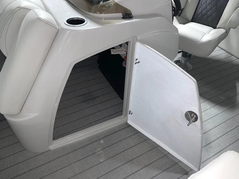 Slide: The Image of 2024 Starcraft SLS 3 boat interior storage compartment with open door. - 8