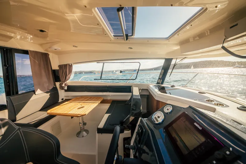 Slide: The Image of Interior of 2022 Parker Poland 800 Weekend boat with seating and navigation equipment. - 17
