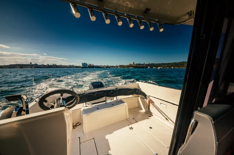 Slide: The Image of Parker Poland 800 Weekend 2022 boat interior with ocean view and city skyline. - 33