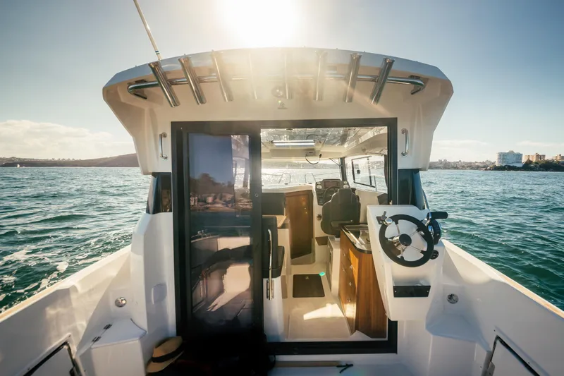 Slide: The Image of Parker Poland 800 Weekend 2022 boat interior with ocean view and sunlight. - 34