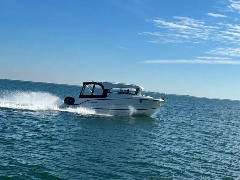 Slide: The Image of 2022 Parker Poland 800 Weekend boat cruising on open water under a clear blue sky. - 37