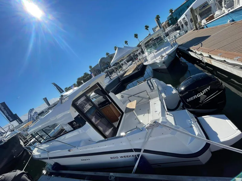 Slide: The Image of 2022 Parker Poland 800 Weekend boat docked under sunny skies. - 38