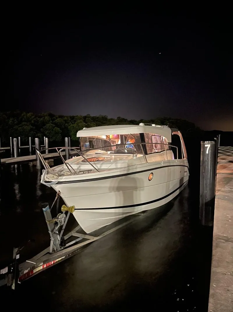 Slide: The Image of 2022 Parker Poland 800 Weekend boat docked at night, illuminated by soft lighting. - 7