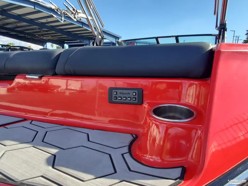 Slide: The Image of 2020 MasterCraft NXT20 boat interior with Klipsch audio controls and cup holder. - 10