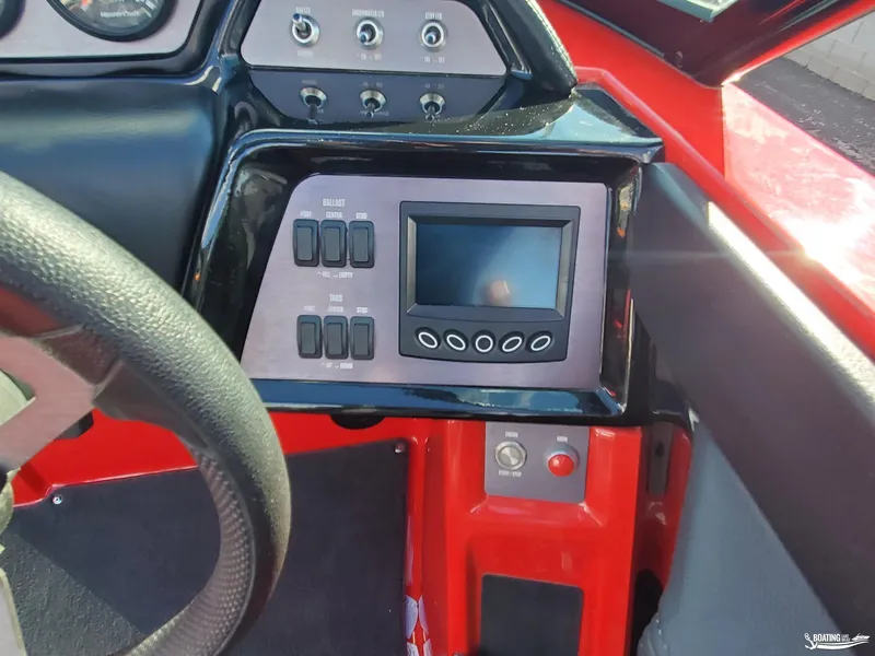 Slide: The Image of 2020 MasterCraft NXT20 dashboard with digital display and control panel. - 13