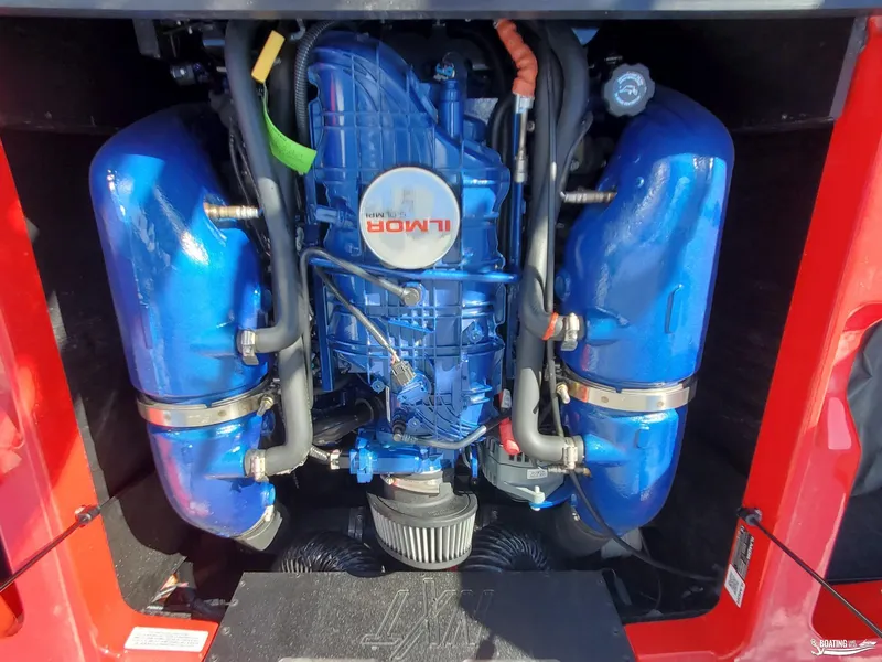 Slide: The Image of 2020 MasterCraft NXT20 engine with blue components and red accents. - 20