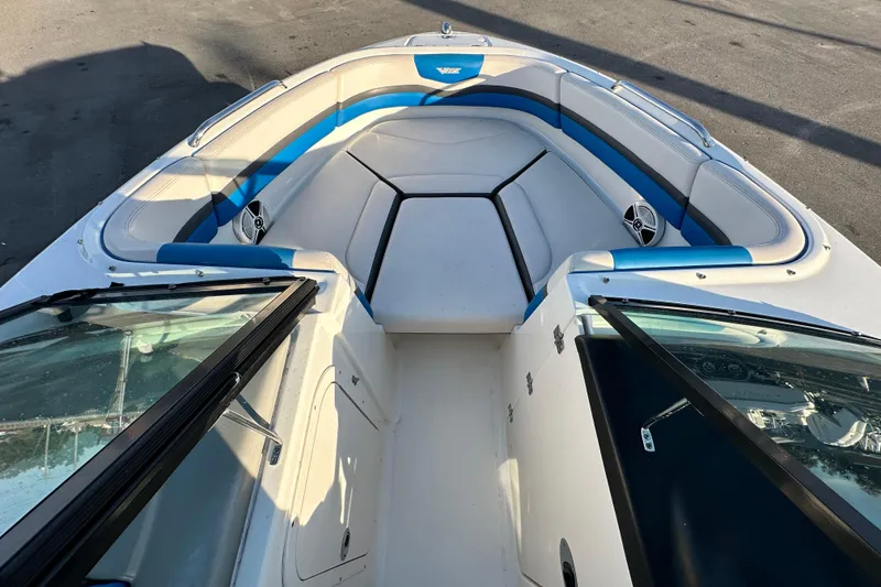 Slide: The Image of 2019 Chaparral Vortex 2430 VRX boat interior with blue and white seating. - 17