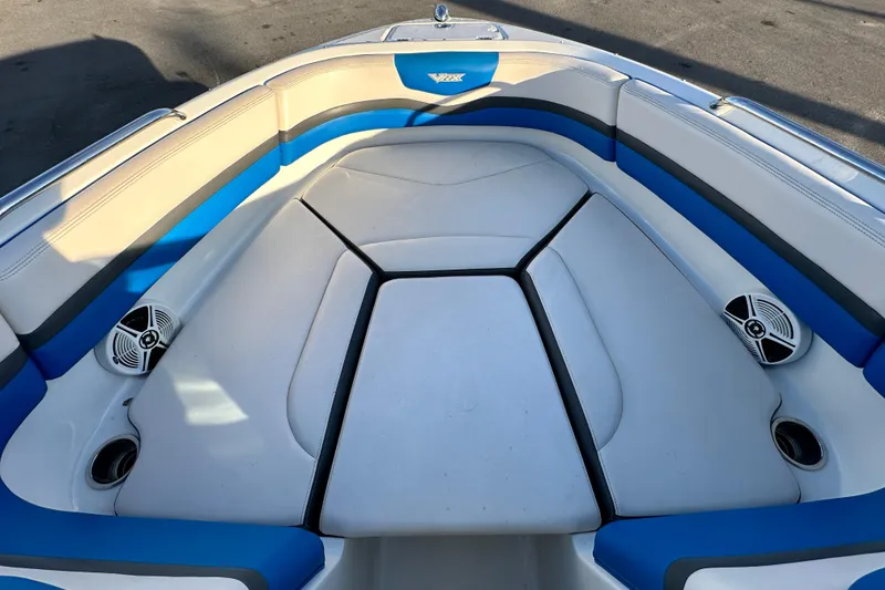 Slide: The Image of 2019 Chaparral Vortex 2430 VRX boat interior with blue and white seating. - 18