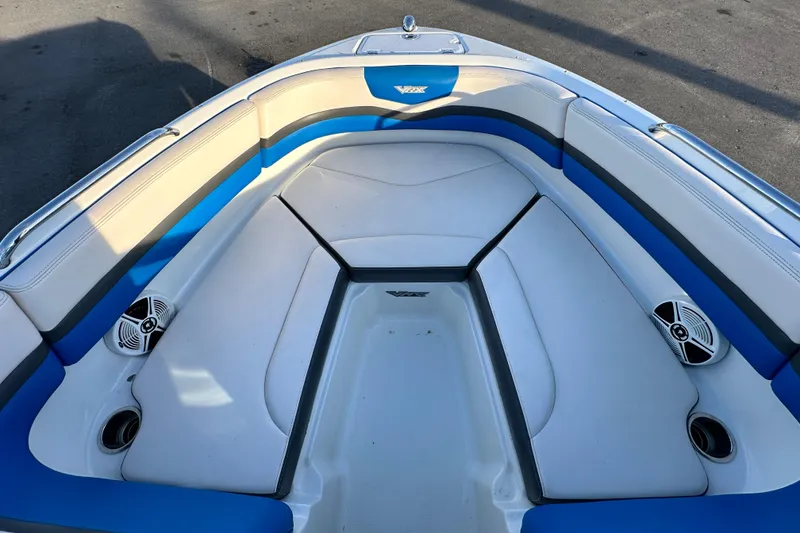 Slide: The Image of 2019 Chaparral Vortex 2430 VRX boat interior with blue and white seating. - 19