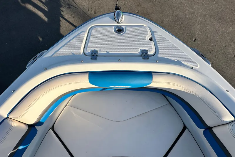 Slide: The Image of 2019 Chaparral Vortex 2430 VRX boat bow with blue and white seating. - 20