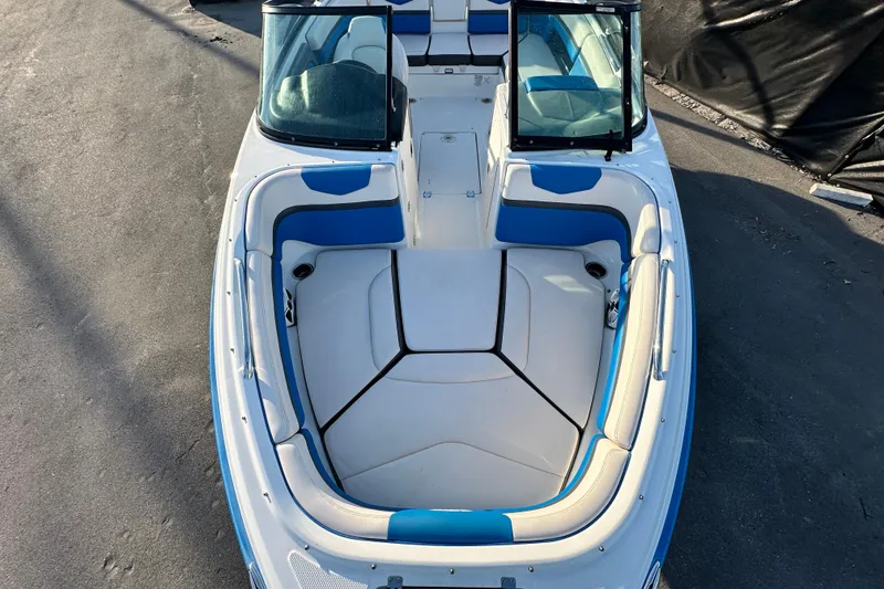 Slide: The Image of 2019 Chaparral Vortex 2430 VRX boat with blue and white seating, viewed from above. - 21
