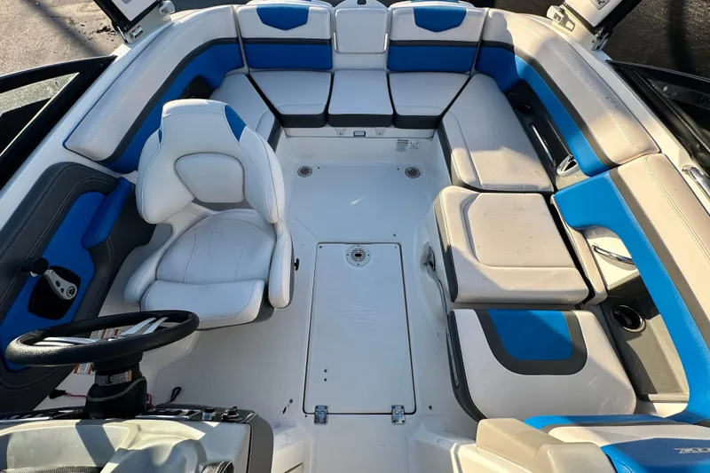 Slide: The Image of 2019 Chaparral Vortex 2430 VRX boat interior with blue and white seating. - 26