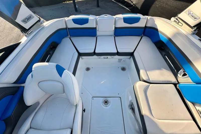 Slide: The Image of 2019 Chaparral Vortex 2430 VRX boat interior with blue and white seating. - 27