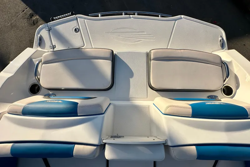 Slide: The Image of 2019 Chaparral Vortex 2430 VRX boat seating area with blue and white cushions. - 29