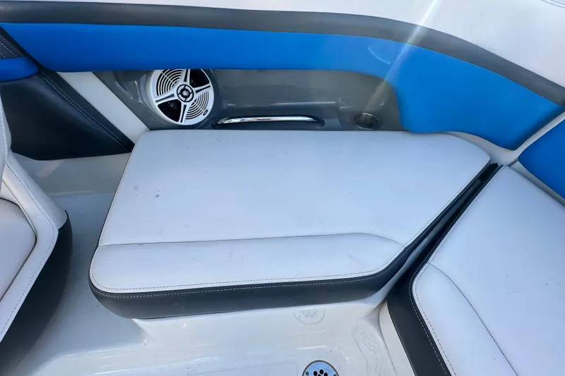 Slide: The Image of 2019 Chaparral Vortex 2430 VRX boat interior with blue and white seating. - 39
