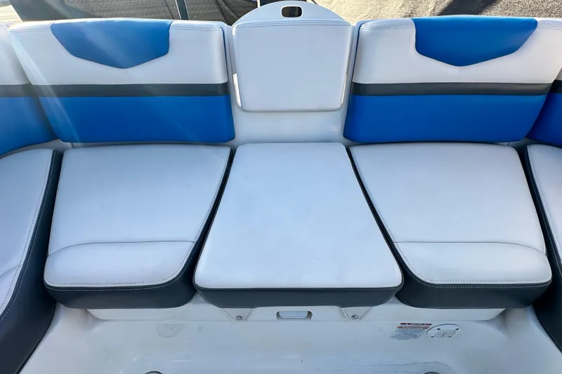 Slide: The Image of 2019 Chaparral Vortex 2430 VRX boat seating with blue and white upholstery. - 42